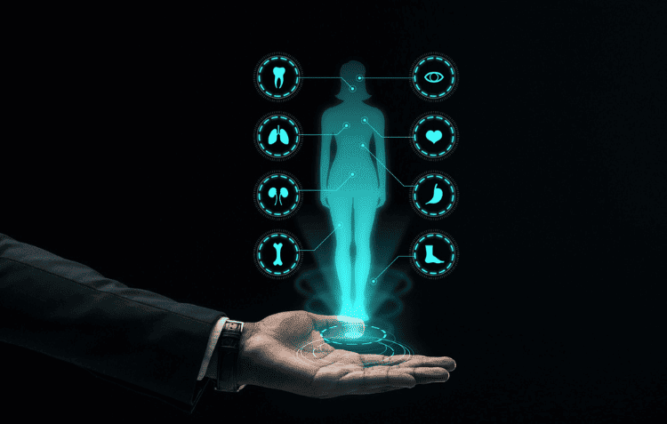 Hand holding holographic display of medical icons representing AI healthcare trends