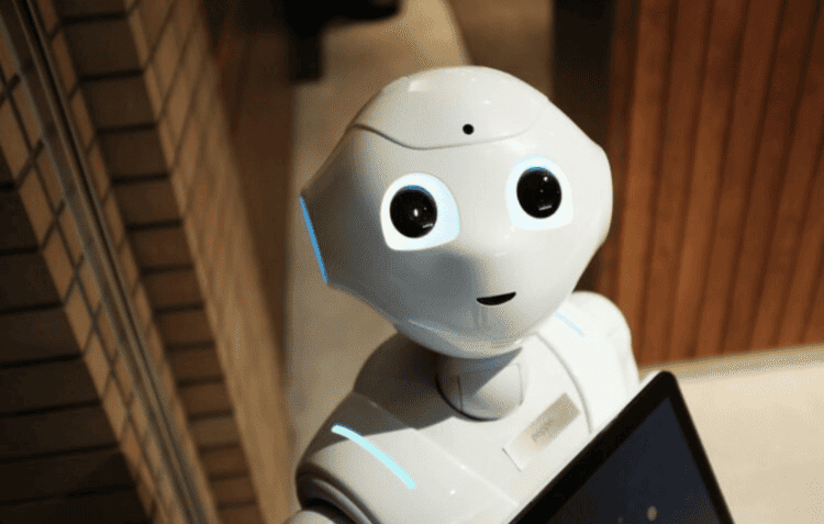 A close-up of a humanoid robot with blue light accents, symbolizing robotics future trends.