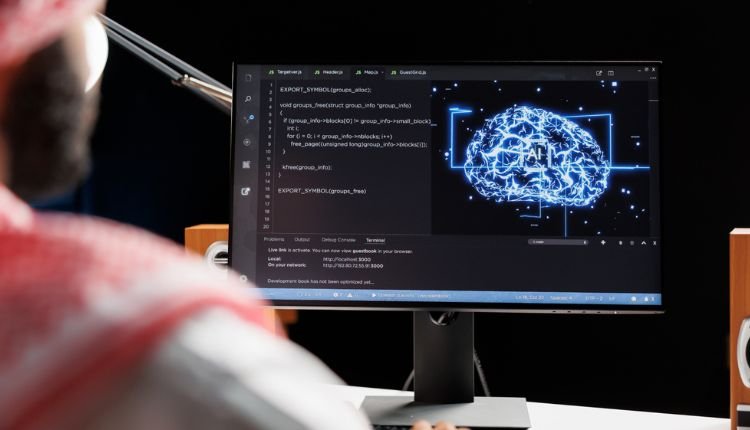 AI brain visualization with code on a monitor screen.