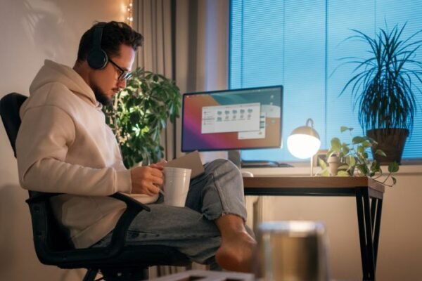 A remote worker working in his workplace representing remote workers.