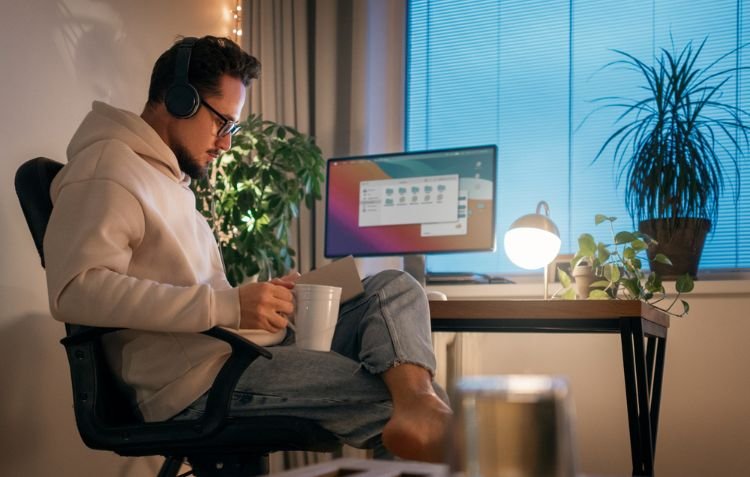 A remote worker working in his workplace representing remote workers.