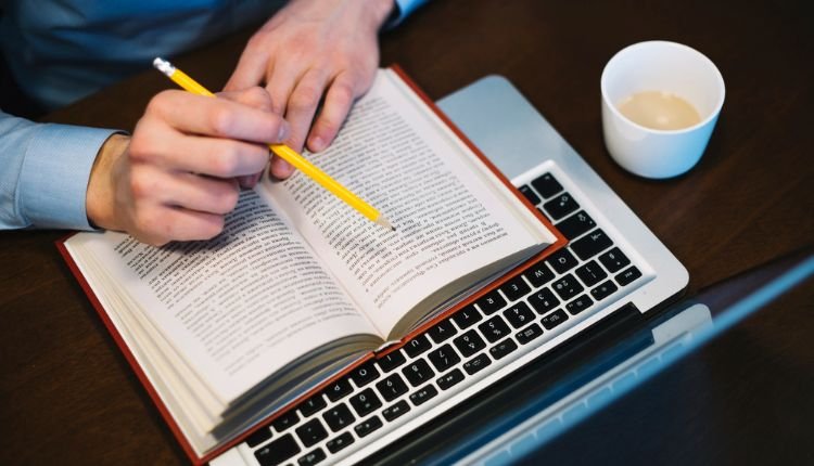 Man taking notes on faith-based social media research