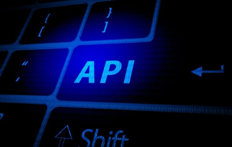 Blue glowing API key on a keyboard for software integration