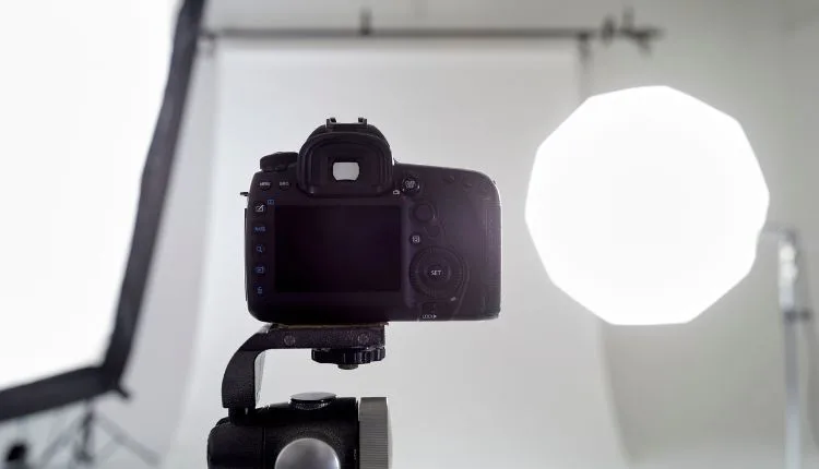How to Start a Photography Business in 7 Easy Steps 5 Camera setup with professional studio lighting